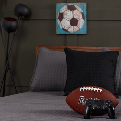 Football and console controller on Vilano Oversized Quilt Set in Slate#color_vilano-slate