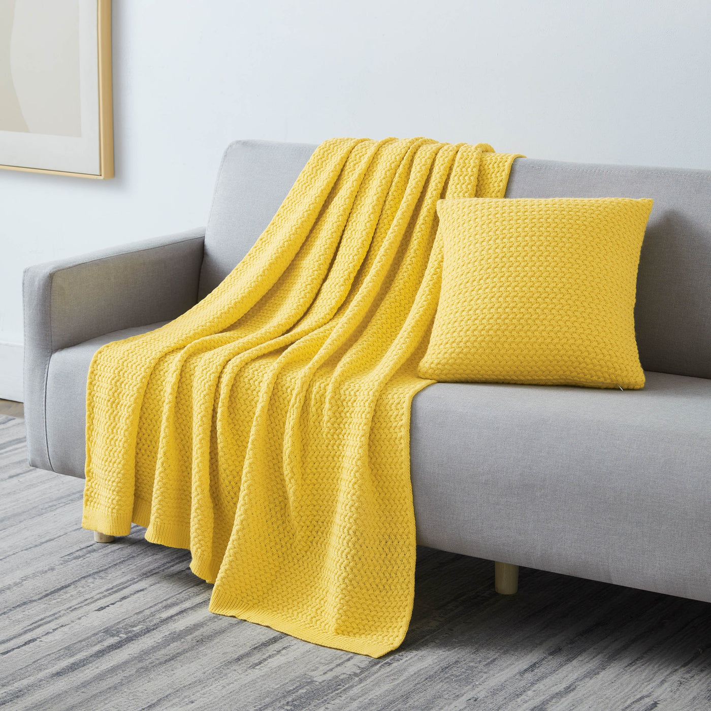 Angled View of Arcylic Throw Set in Yellow on Sofa#color_acrylic-yellow