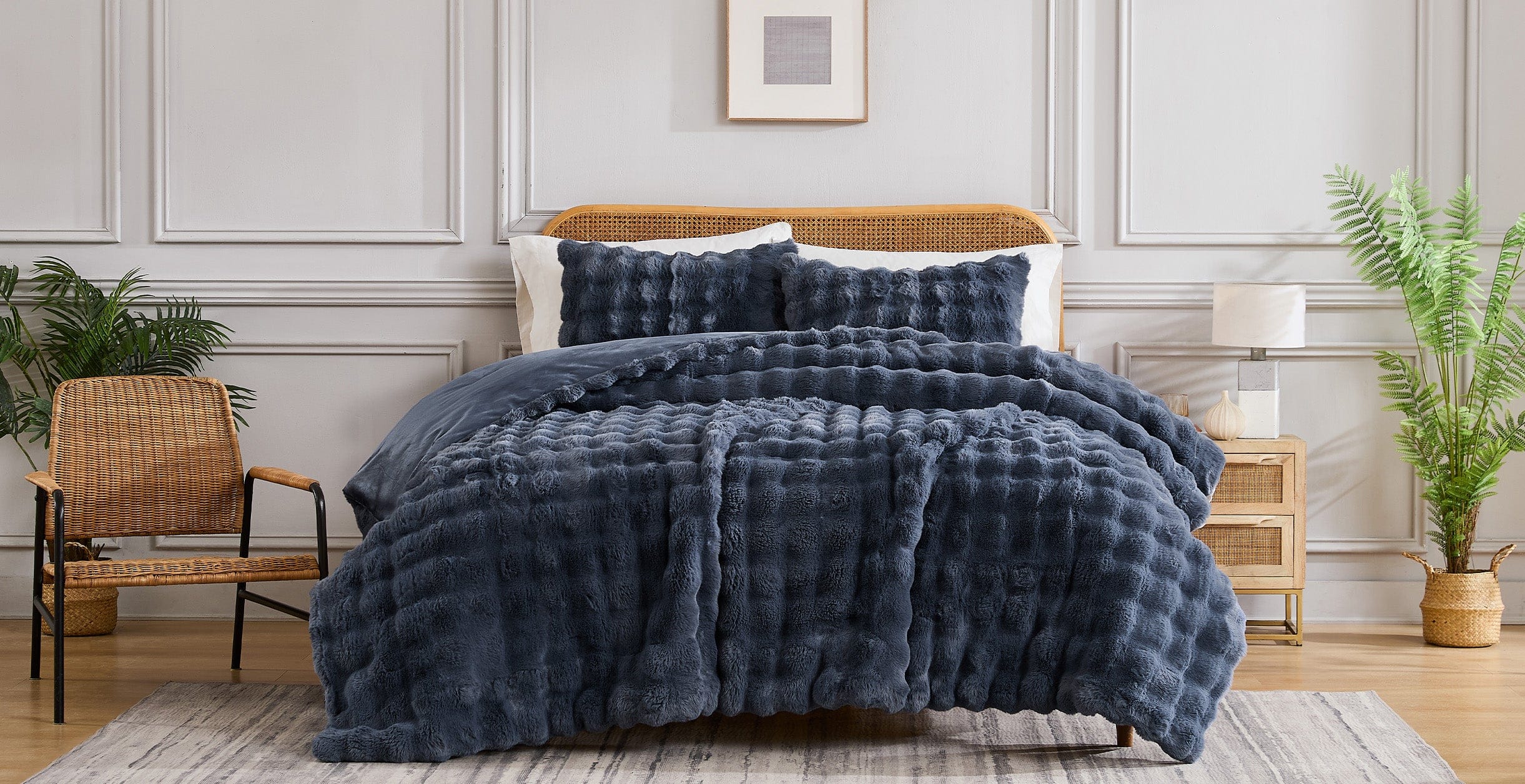 Faux fur comforter on a styled bed
