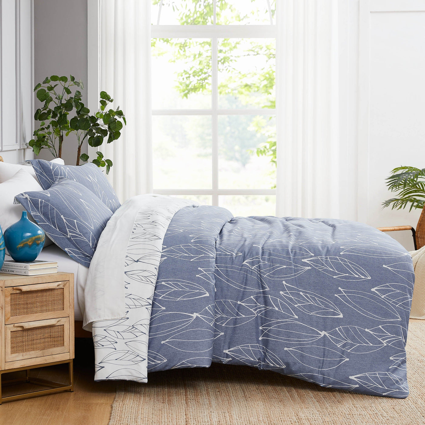 Side View of Reversible Modern Foliage Comforter Set in Blue#color_modern-foliage-blue
