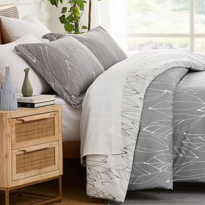 Side View of Reversible Modern Foliage Comforter Set in Grey#color_modern-foliage-grey