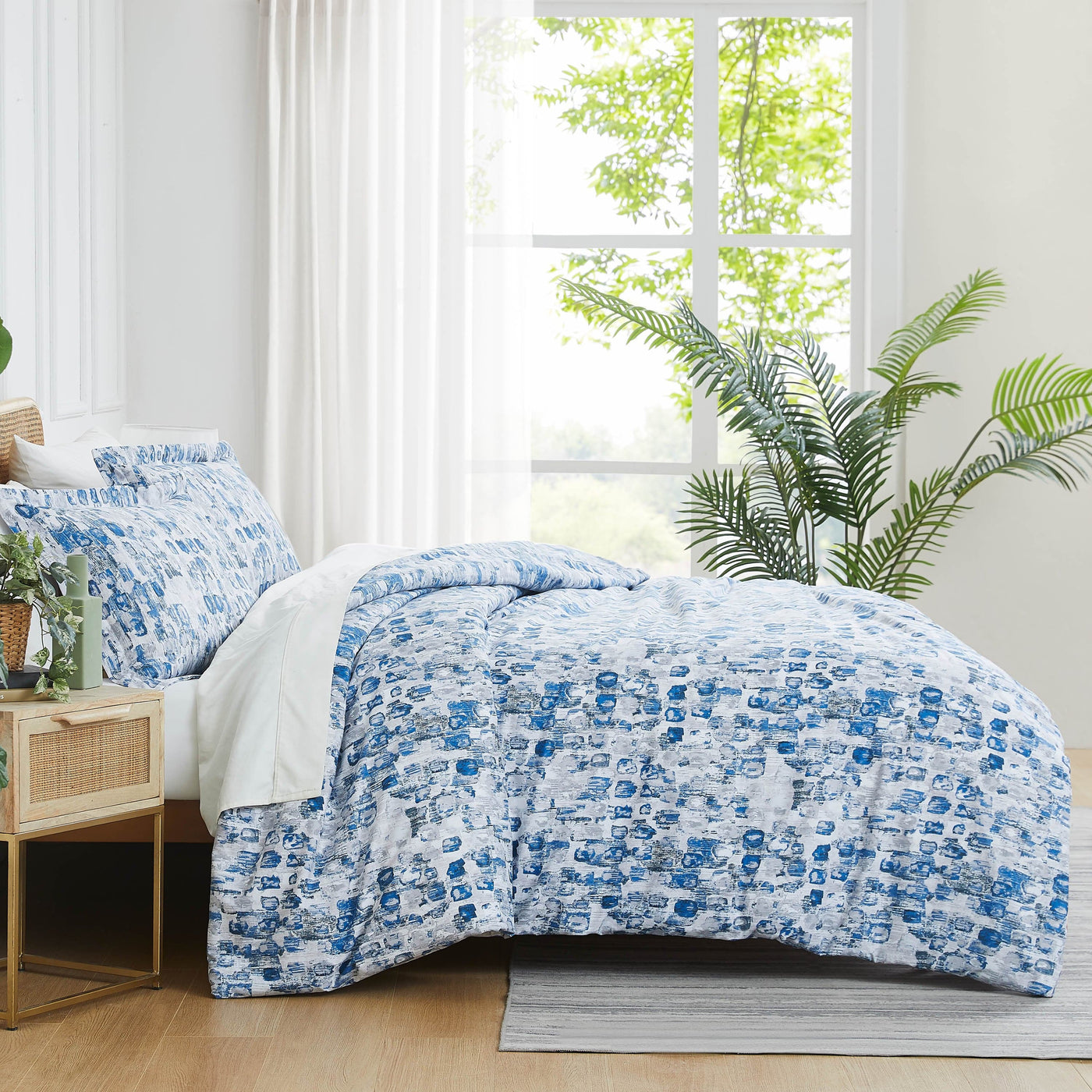 Side View of Rhythm Comforter Set in blue#color_rhythm-blue