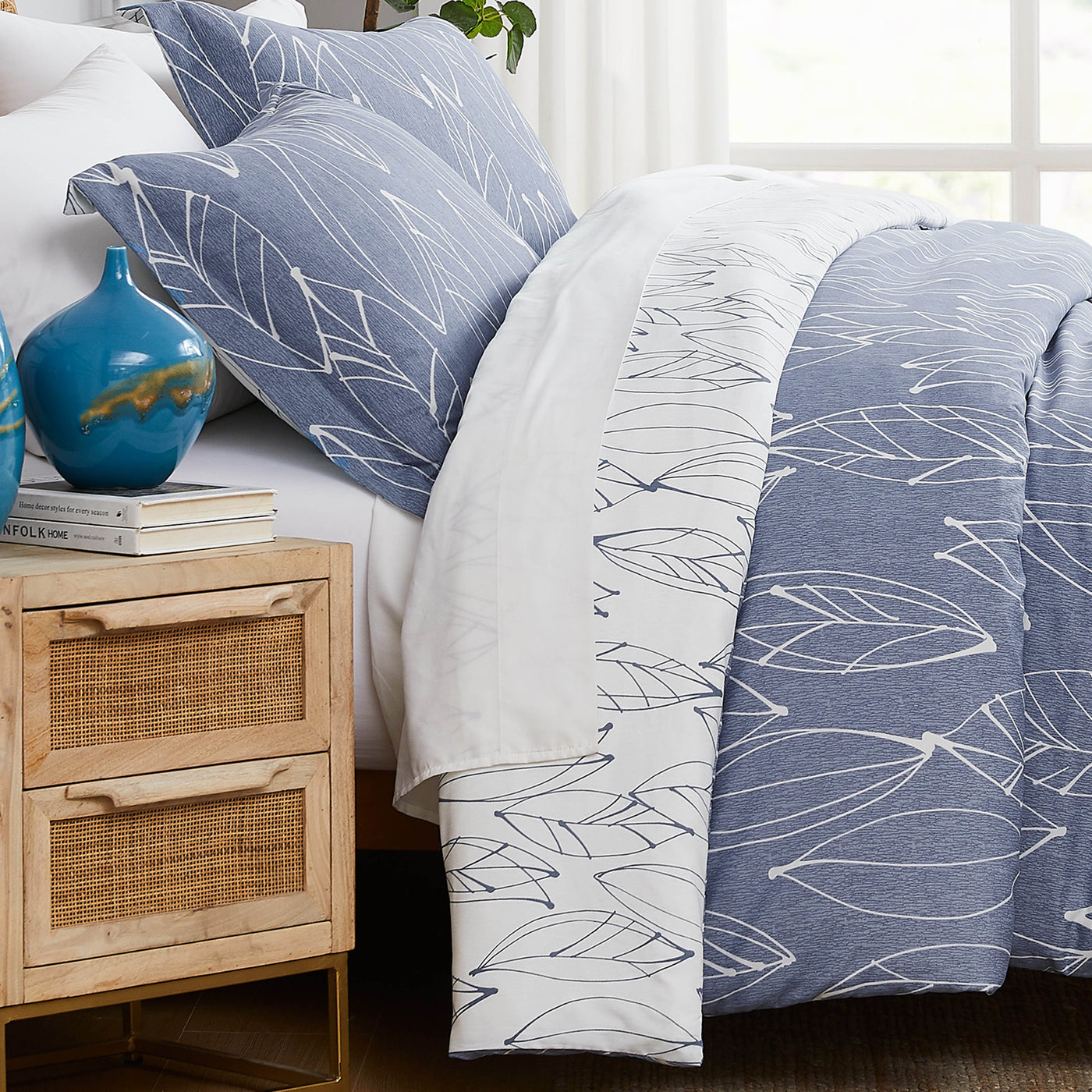 Side View of Reversible Modern Foliage Duvet Cover Set in Blue#color_modern-foliage-blue