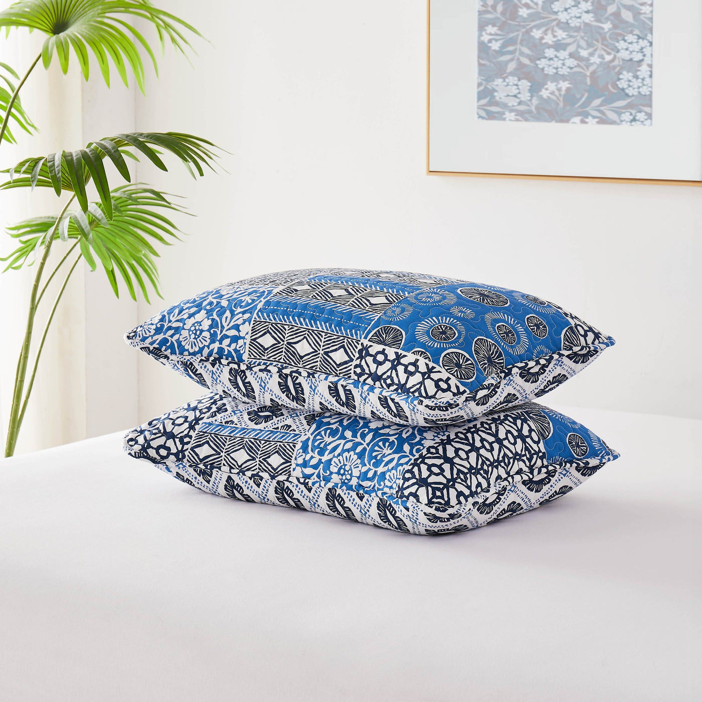 Global Patch Quilted Sham Covers Stack Together in Blue#color_global-patch-blue