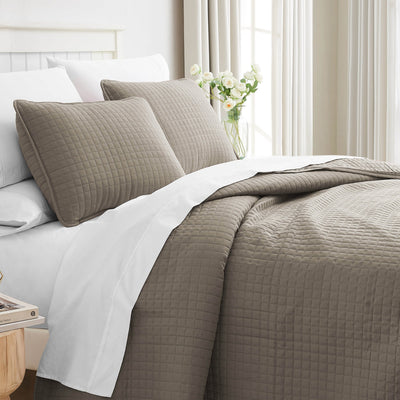 Angled View of Vilano Oversized Quilt in Dark Taupe#color_vilano-dark-taupe
