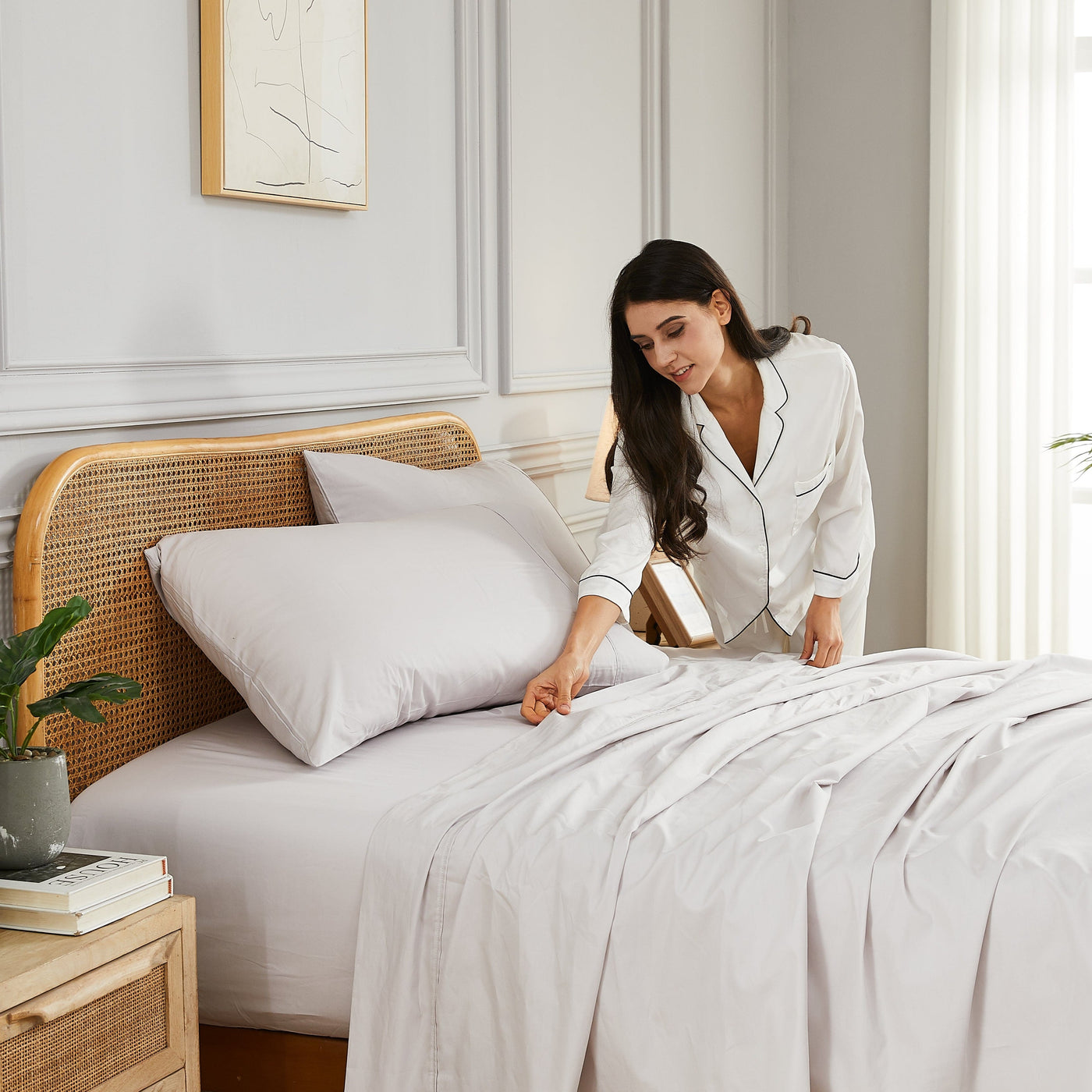 Lady making bed with Percale Sheet Set in Grey#color_percale-lunar-grey