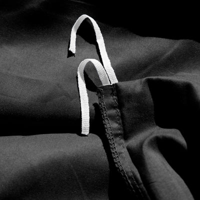 Close Up Image of Corner Ties of Everyday Essentials Duvet Cover Set in Black#color_black