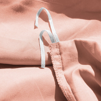 Close Up Image of Corner Ties of Everyday Essentials Duvet Cover Set in Peach#color_peach