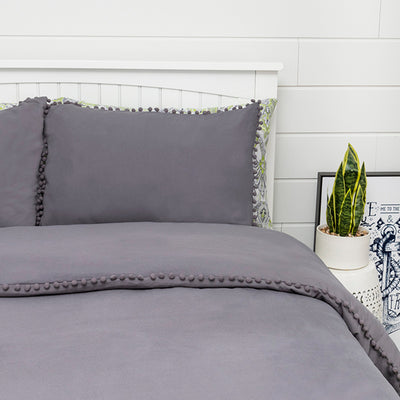 Side View of Pom-Pom Duvet Cover Set in Light Grey#color_slate
