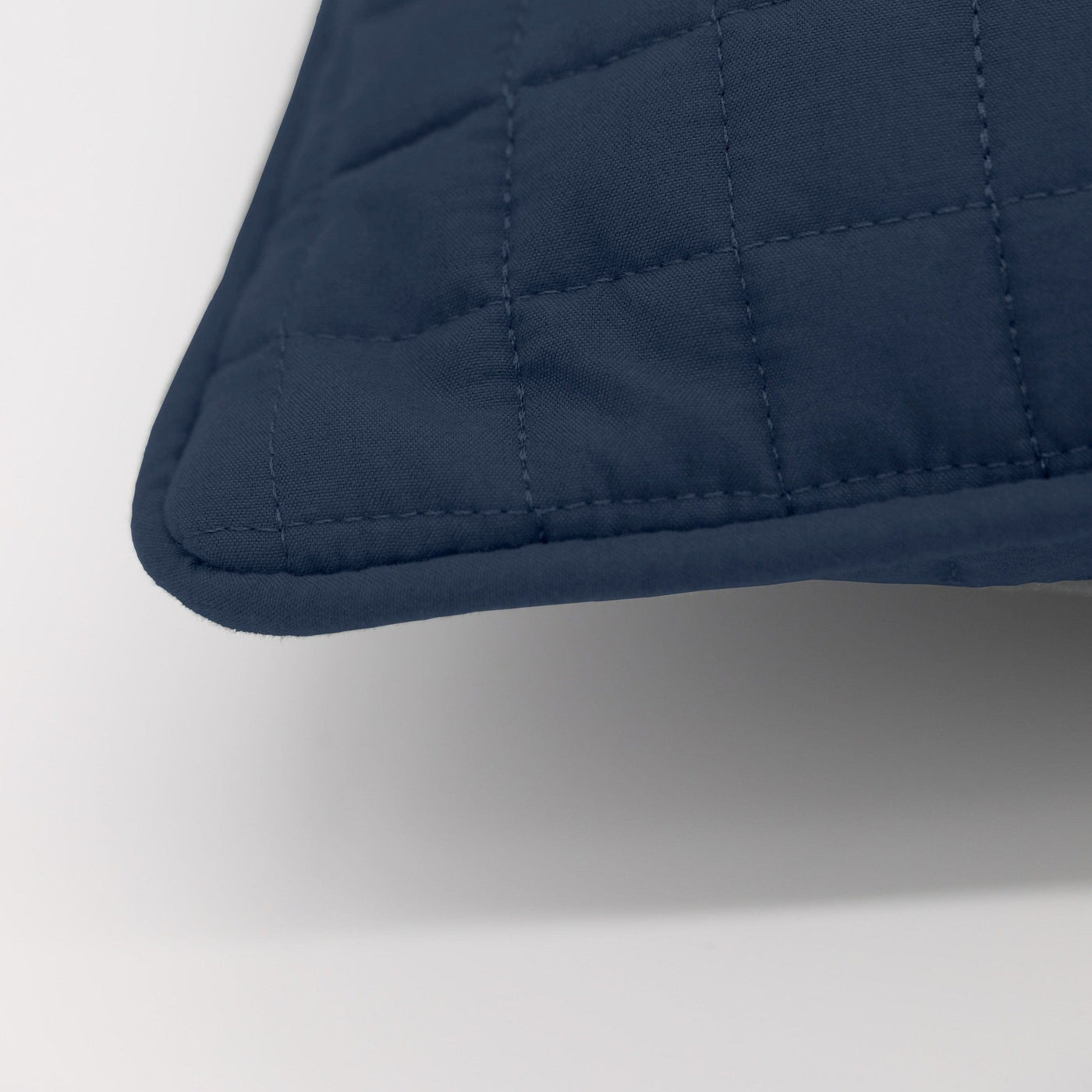 Details and Texture of Vilano Quilted Sham and Pillow Covers in Dark Blue#color_vilano-dark-blue