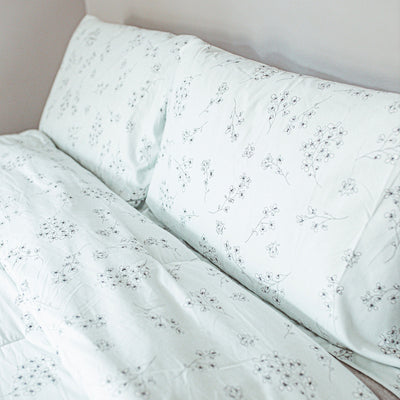 Close Up View of Sweet Florals Pillow Shams in Grey#color_sweet-ballard-blue