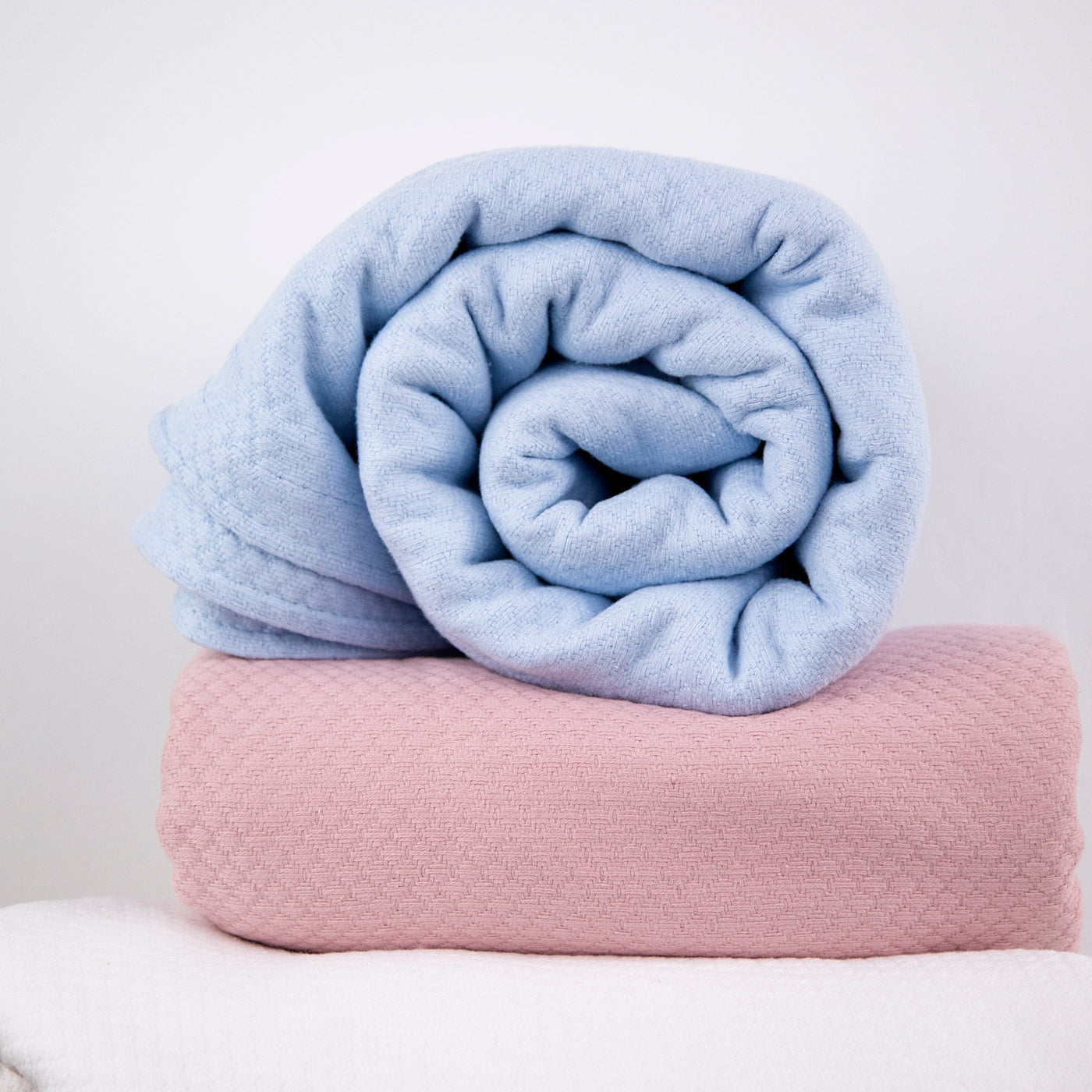 Milton Cotton Blankets and Throws in Pink and Blue Stack Together#color_all