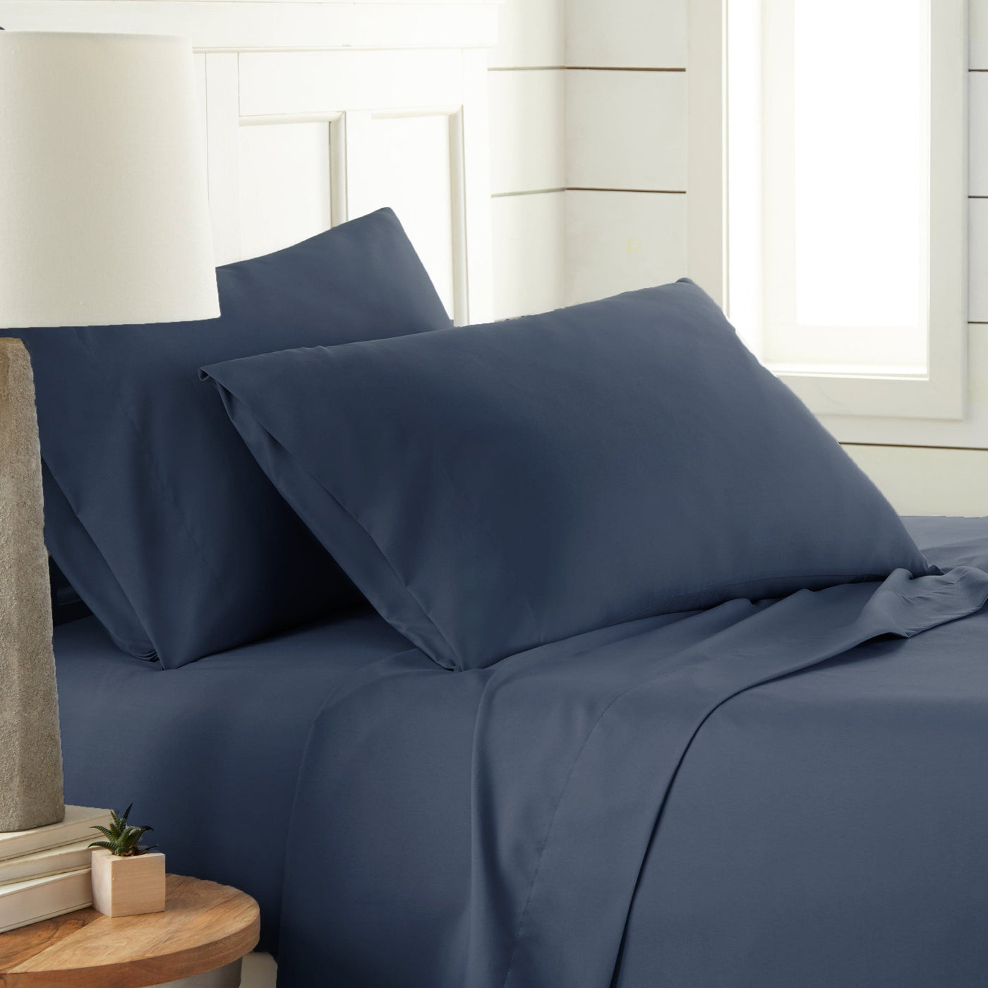 Side View of Southshore Essentials 4-Piece Sheet Set in Navy Blue#color_navy-blue