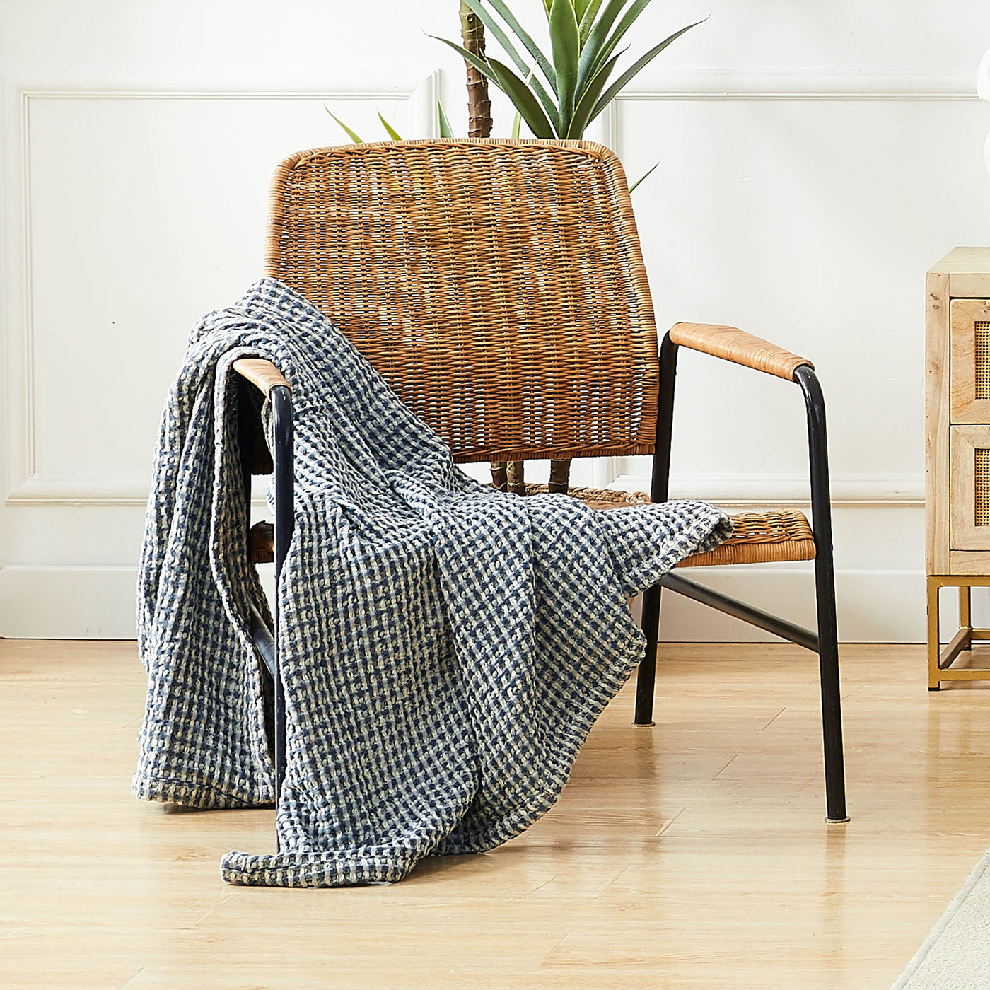 Tama Cotton Blanket and Throw in steel blue on chair#color_tama-steel-blue
