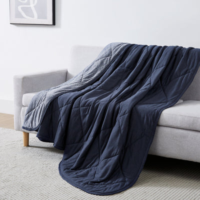 Performance Cooling Blankets and Throws on Couch in Navy Blue#color_cooling-blanket-blue