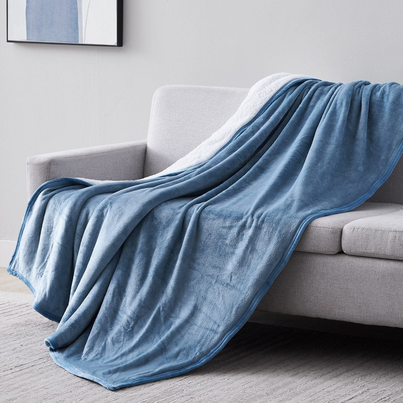 Sherpa-Fleece Oversized Reversible Blankets and Throws in Blue on Sofa#color_microfleece-blue