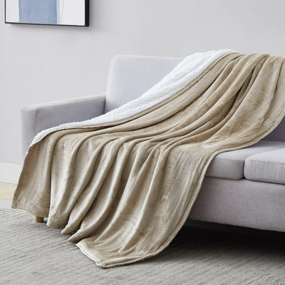 Sherpa-Fleece Oversized Reversible Blankets and Throws in Sand on Sofa#color_microfleece-sand