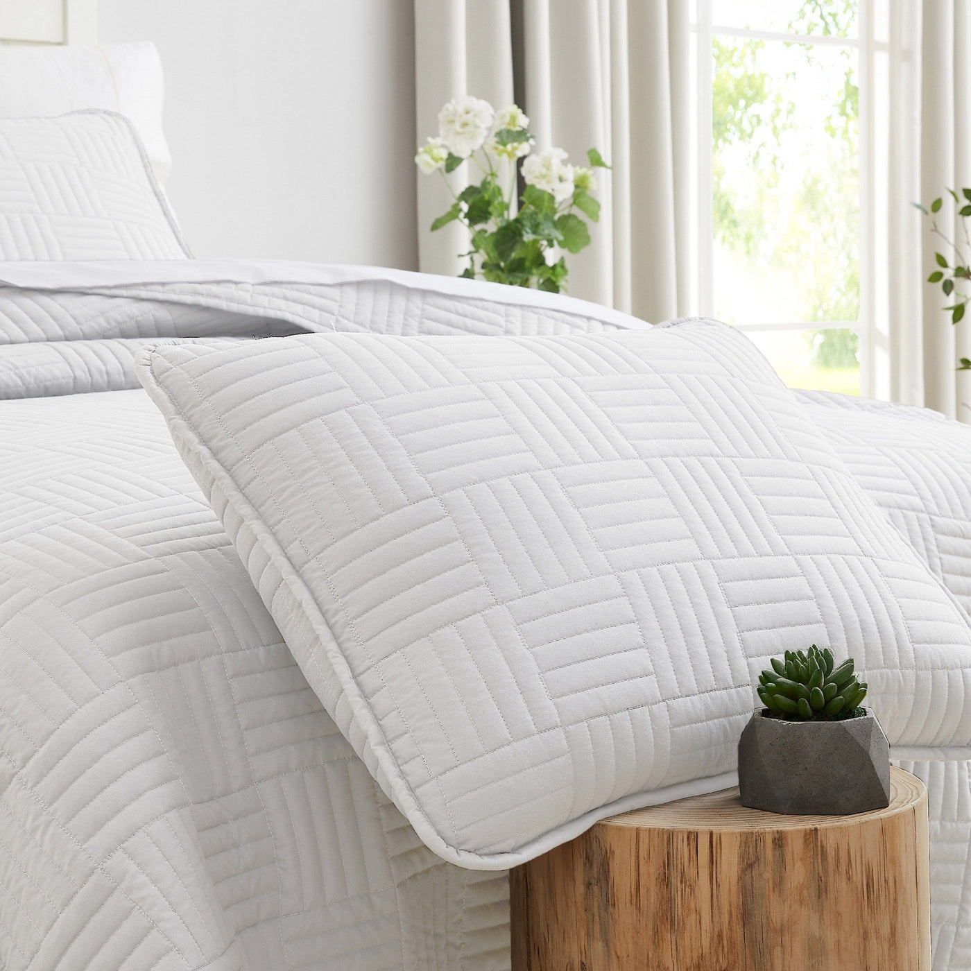 Close Up View of Grid Pillow Shams in White#color_grid-white