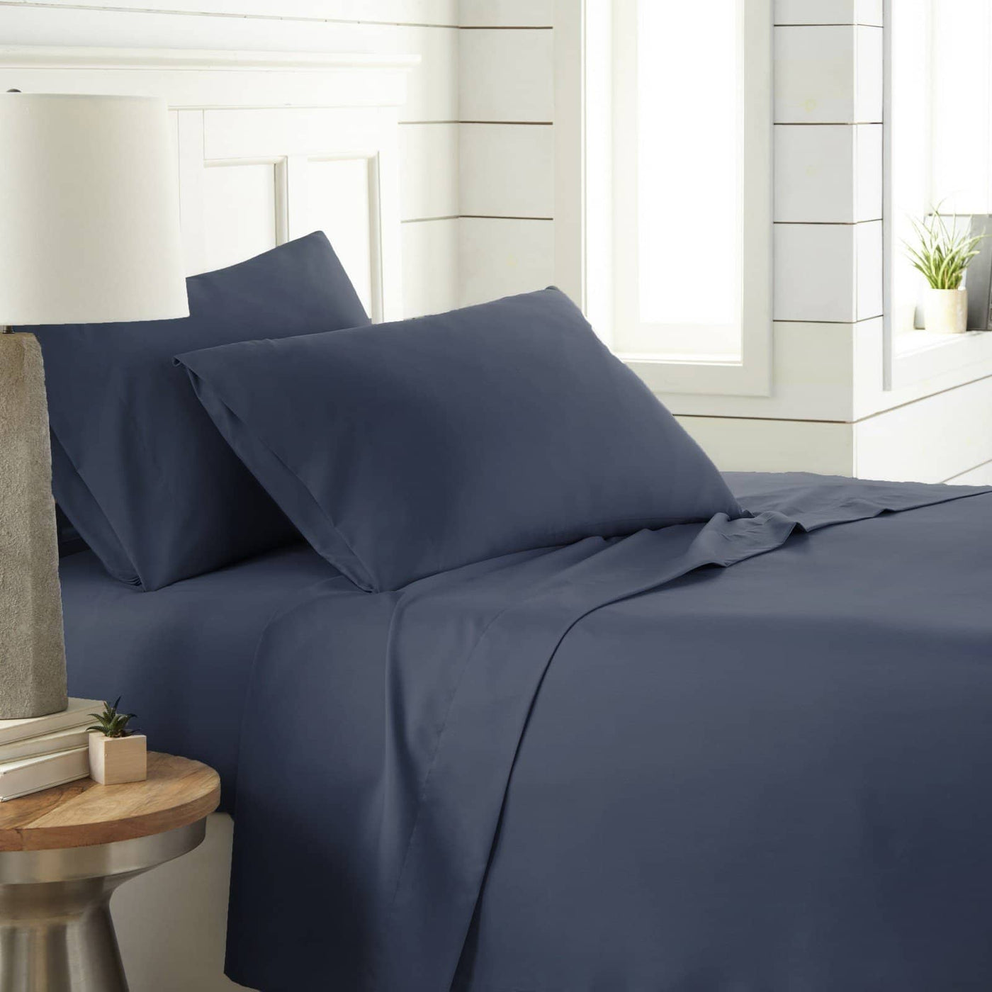 Angled View of Southshore Essentials 4-Piece Sheet Set in Navy Blue#color_navy-blue