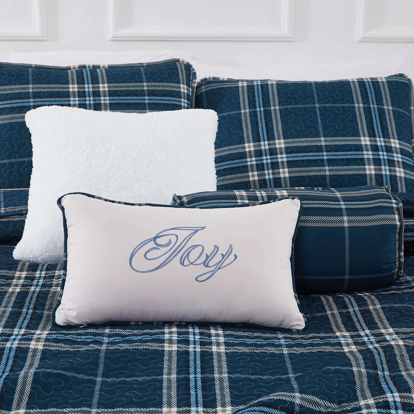 Close Up View of Vilano Plaid Quilted Shams and Pillows in Blue#color_plaid-blue
