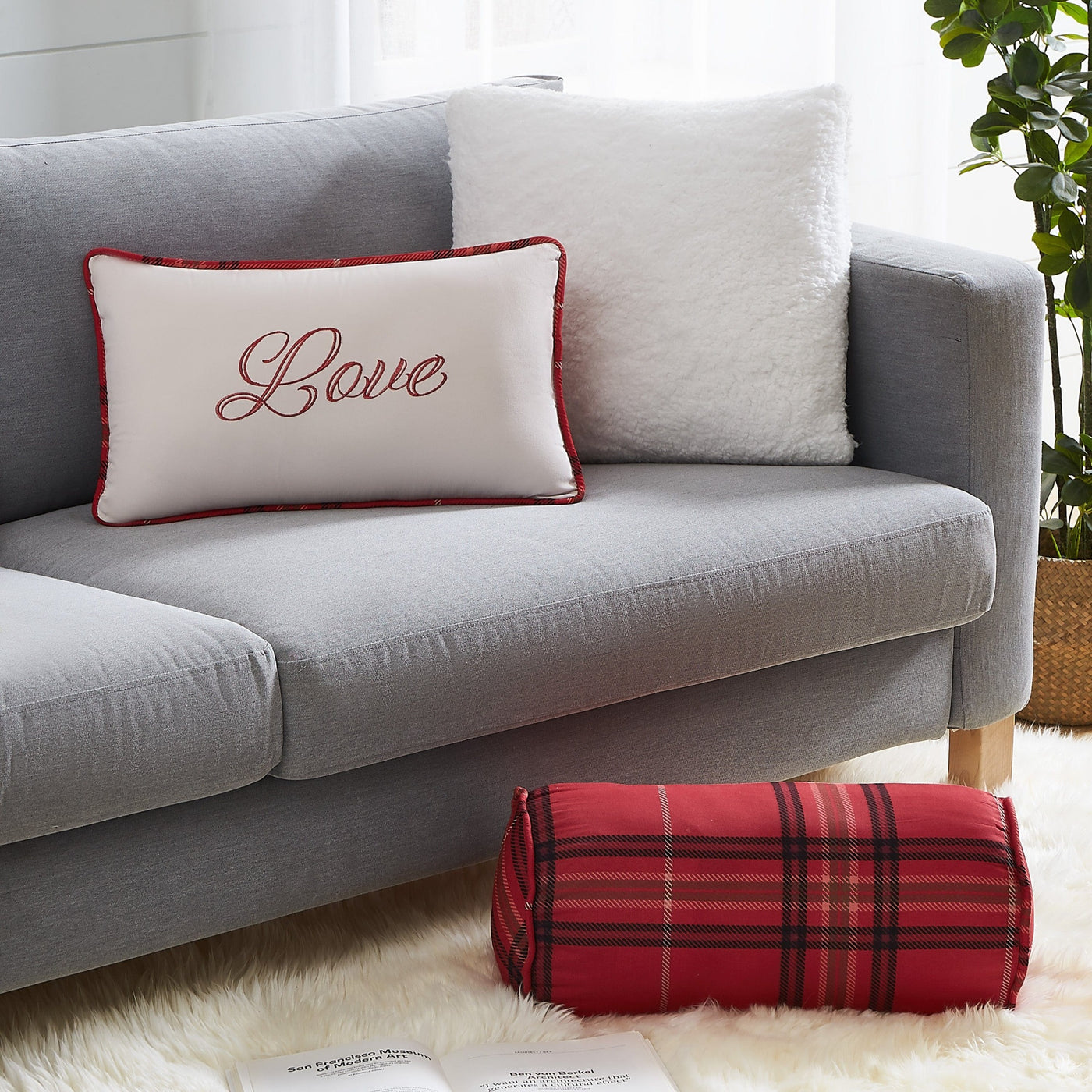 Close Up View of Vilano Plaid Pillow Shams in Red on Sofa and Floor#color_plaid-red