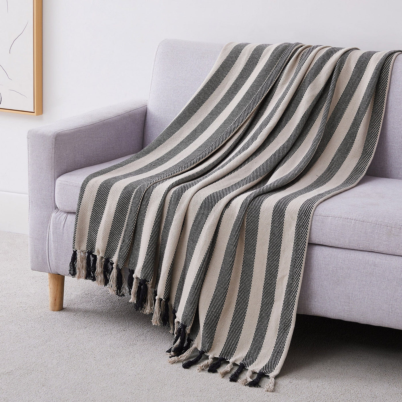 Striped Cotton Blankets and Throws in Black on Sofa#color_striped-black