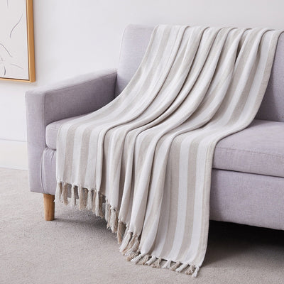 Striped Cotton Blankets and Throws in Taupe on Sofa#color_striped-taupe