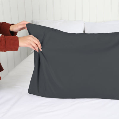 Lady setting up a Vilano Springs 2-Piece Pillow Cases in Slate#color_vilano-slate