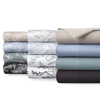 Stacked view of Winter Brush pillow cases showcasing watercolor floral print on cotton sateen fabric with white background