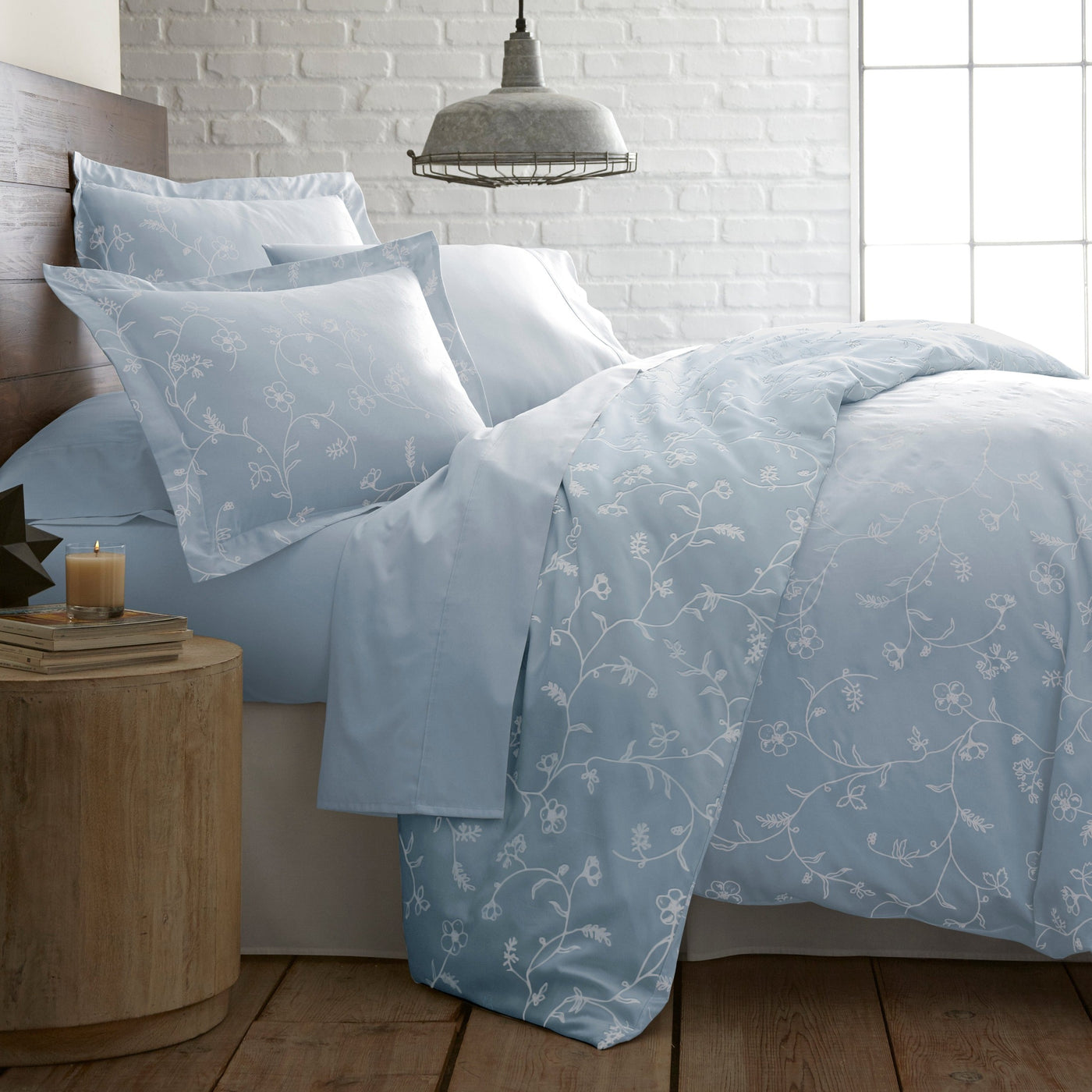 Close Up View of Sweetbrier Pillow Shams in Blue with White Flowers#color_sweetbrier-ballard-blue--with-white-flowers
