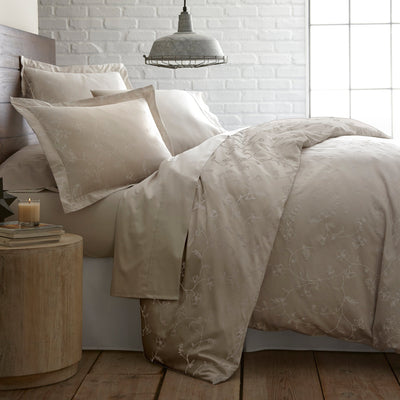Side View of Sweetbrier Duvet Cover Set in Soft Sand with White Flowers#color_sweetbrier-soft-sand-with-white-flowers
