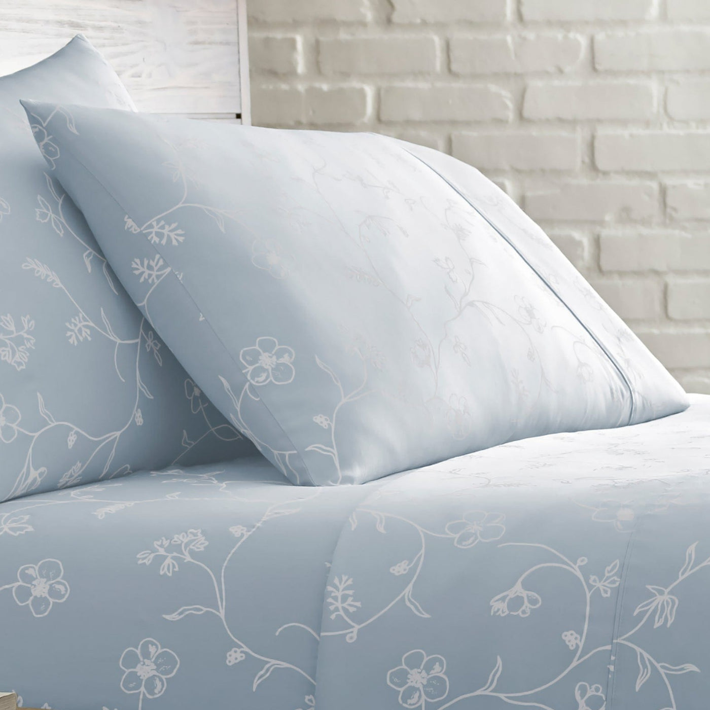 Close Up View of Sweetbrier Pillow Shams in Blue with White Flowers#color_sweetbrier-ballard-blue-with-white-flowers