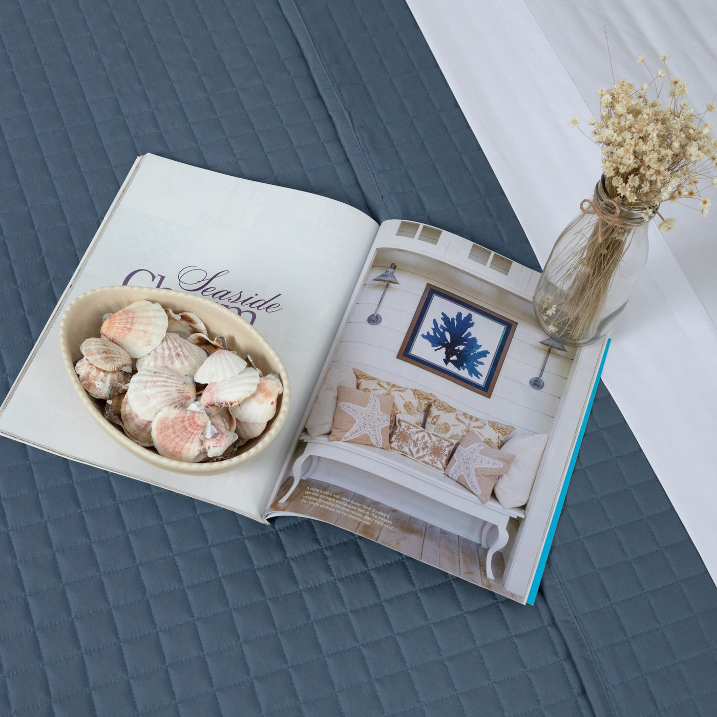 Magazine and seashells on Vilano Oversized Quilt Set in Coronet Blue#color_vilano-coronet-blue