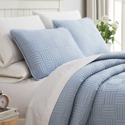 Angled View of Grid Oversized Quilt Set in Dusty Blue#color_grid-dusty-blue