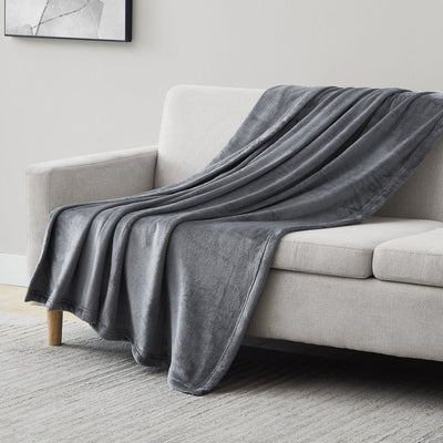 Microfleece Oversized Blankets and Throws in Slate on Sofa#color_microfleece-slate