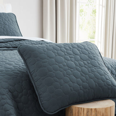 Close Up Image of Pebble Oversized Quilt Set in Blue Mirage Pillow Shams#color_pebbles-blue-mirage