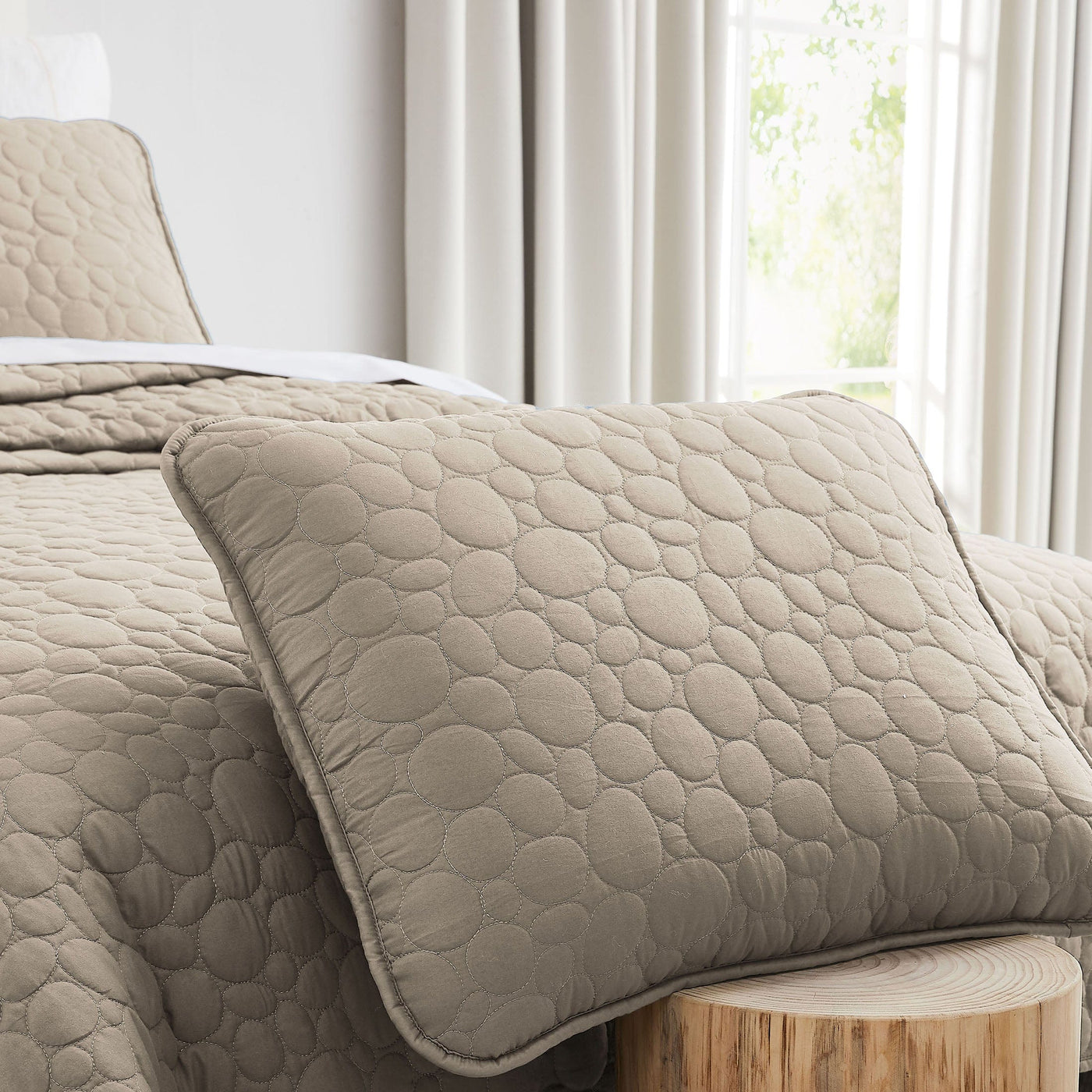 Close Up Image of Pebbles Oversized Quilt Set in Taupe Pillow Shams#color_pebbles-taupe