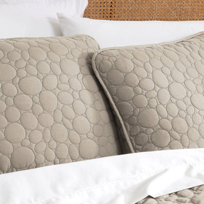 Close Up Image of Pebbles Oversized Quilt Set in Taupe Pillow Shams#color_pebbles-taupe