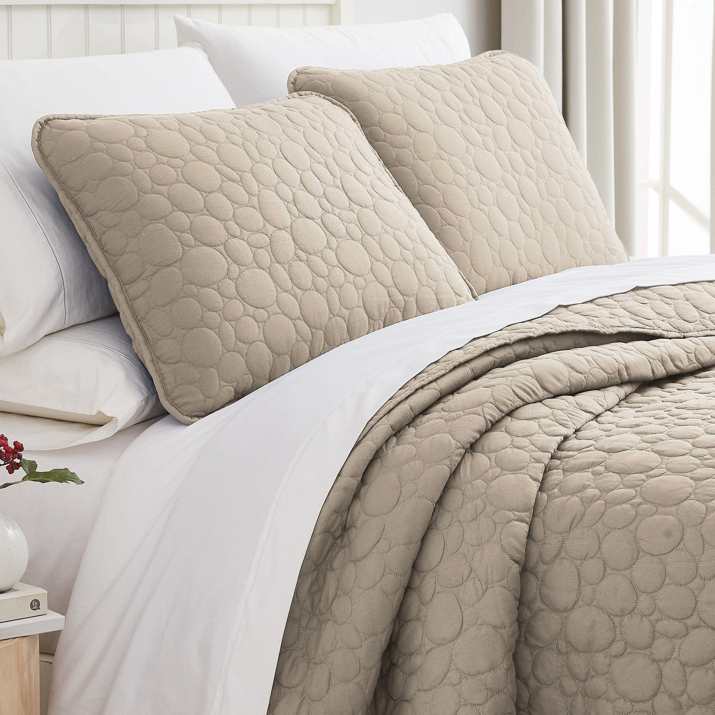 Angled View of Pebbles Oversized Quilt Set in Taupe#color_pebbles-taupe