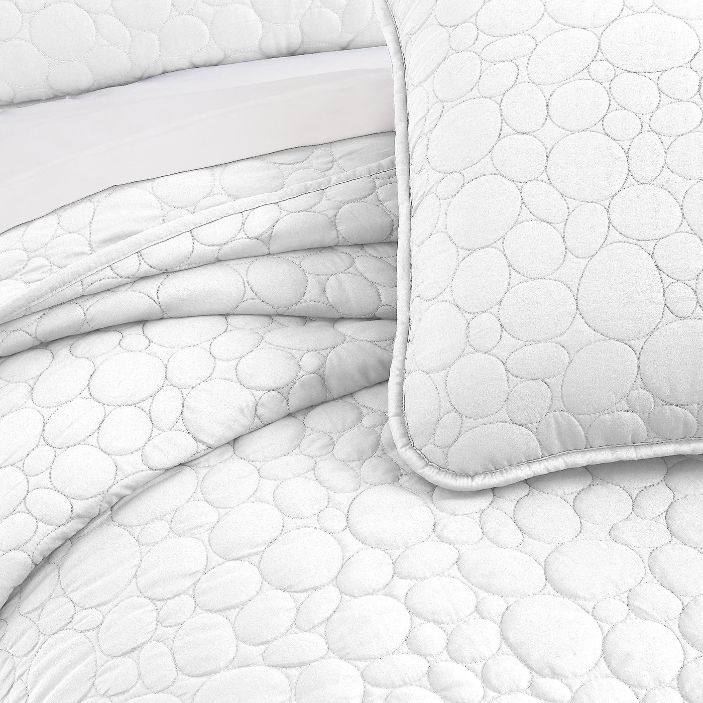 Details and Texture of Pebbles Oversized Quilt Set in White#color_pebble-white