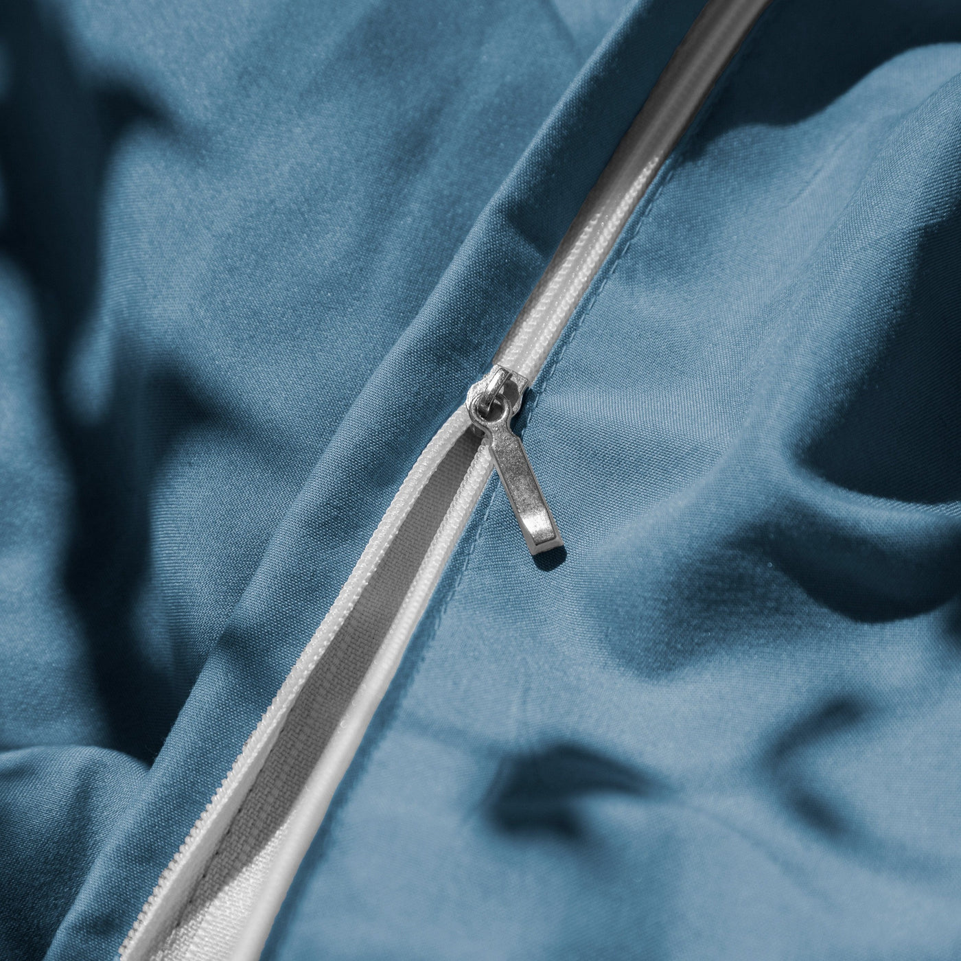 Close Up Image of Zipper Enclosure of Vilano Duvet Cover Set in Coronet Blue#color_vilano-coronet-blue