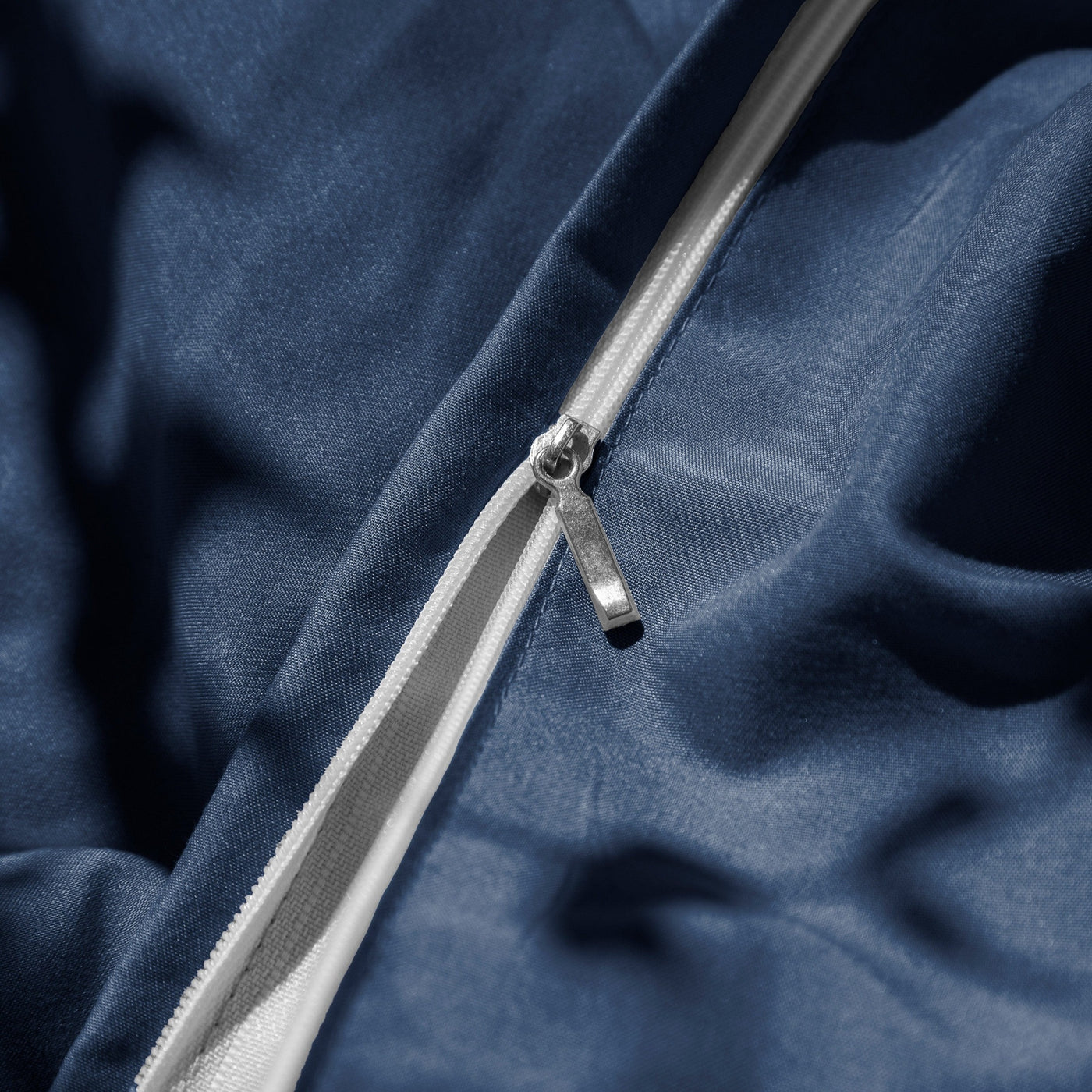 Close Up Image of Zipper Enclosure of Vilano Duvet Cover Set in Dark Blue#color_vilano-dark-blue