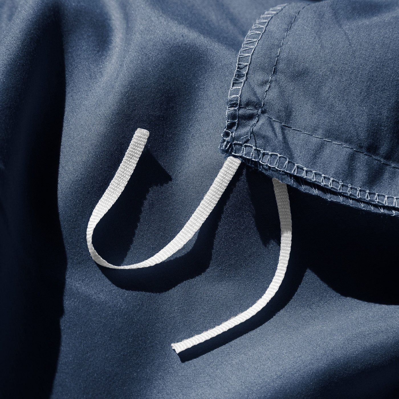 Close Up Image of Corner Ties of Vilano Duvet Cover Set in Dark Blue#color_vilano-dark-blue