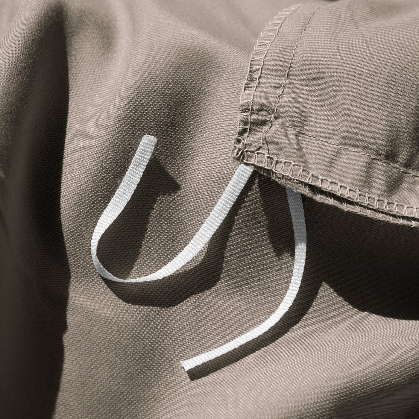 Close Up Image of Corner Ties of Vilano Duvet Cover Set in Dark Taupe#color_vilano-dark-taupe