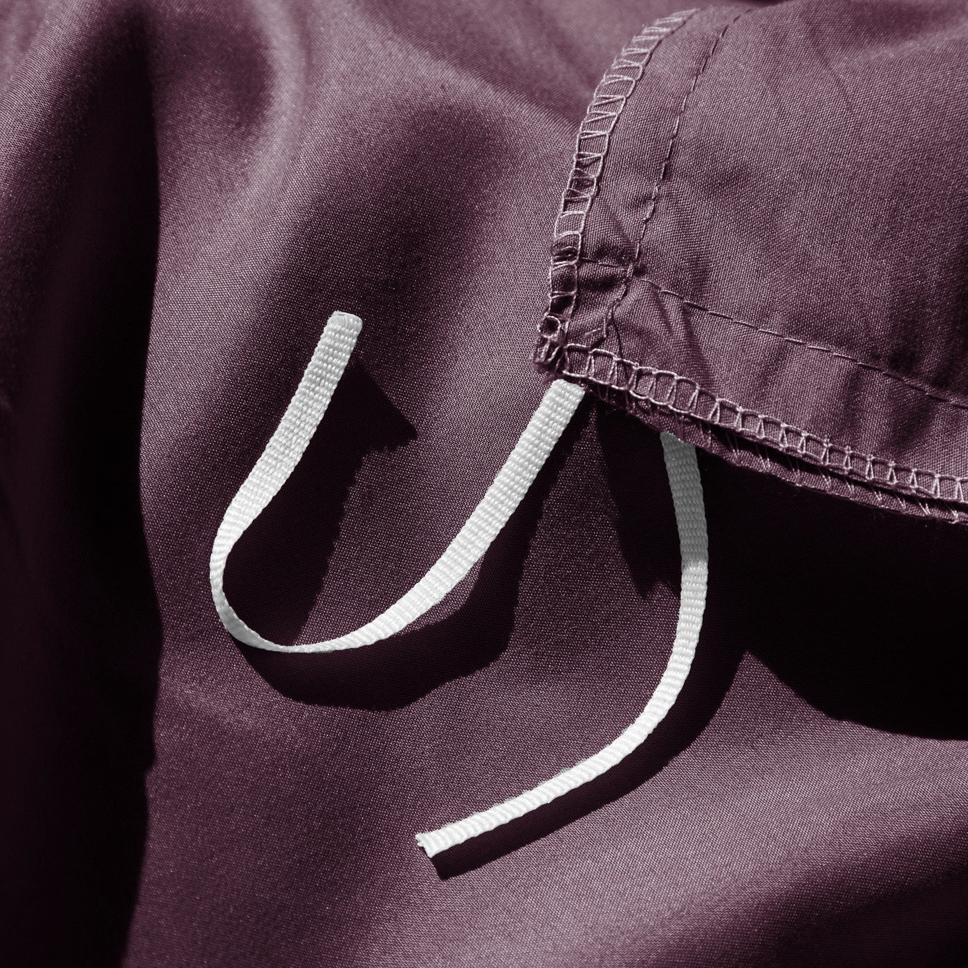 Close Up Image of Corner Ties of Vilano Duvet Cover Set in Purple#color_vilano-purple