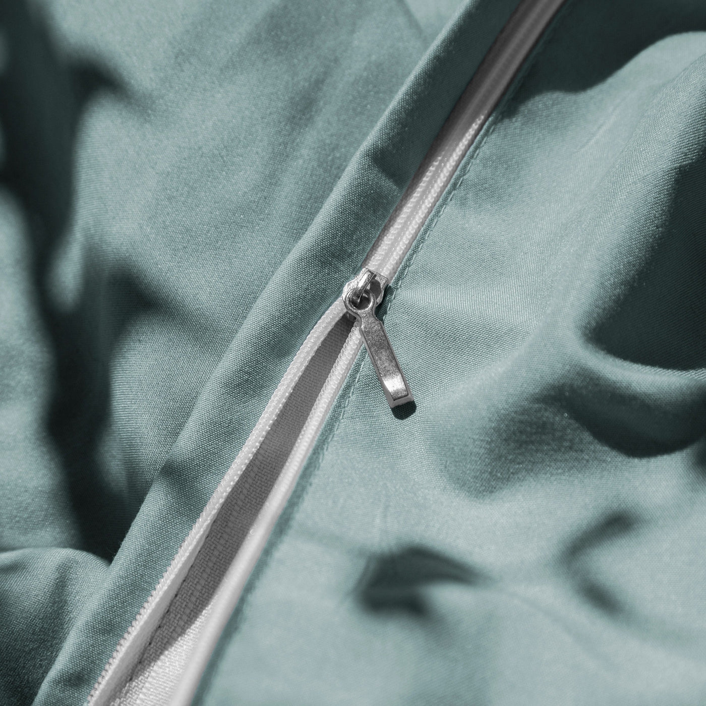 Close Up Image of Zipper Enclosure of Vilano Duvet Cover Set in Steel Blue#color_vilano-steel-blue