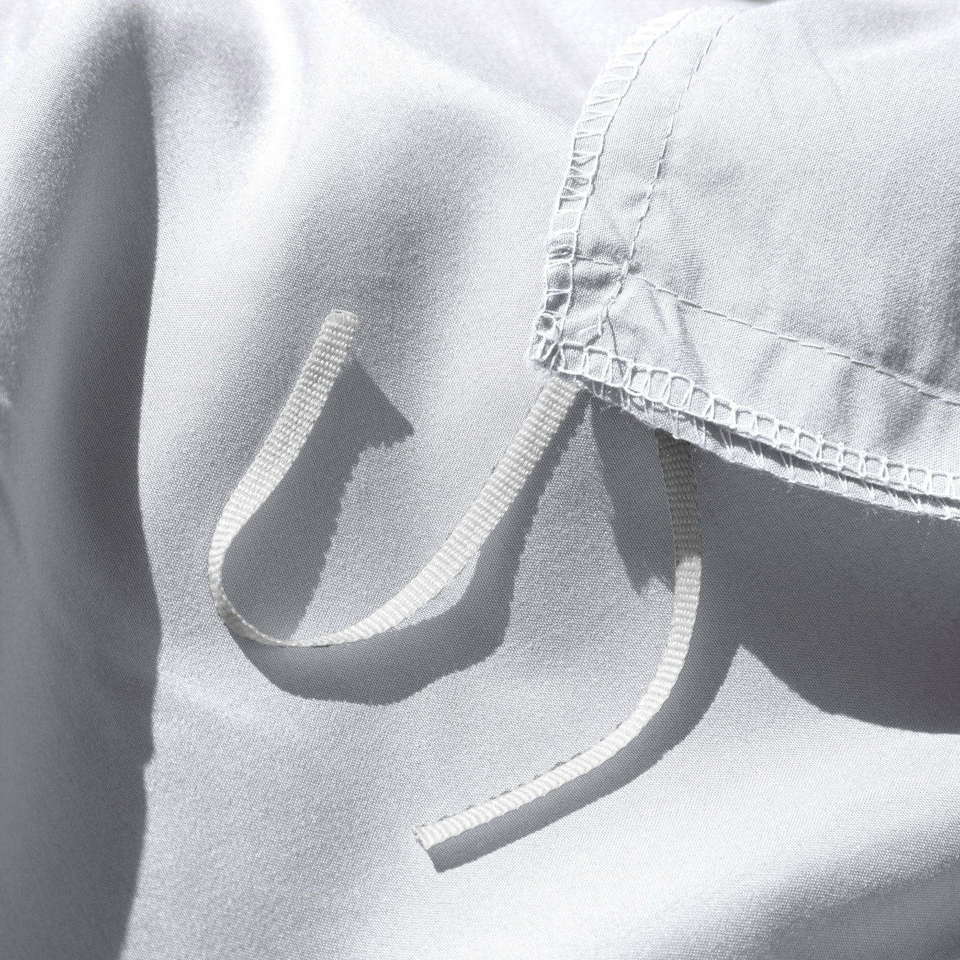 Close Up Image of Corner Ties of Vilano Duvet Cover Set in White#color_vilano-bright-white