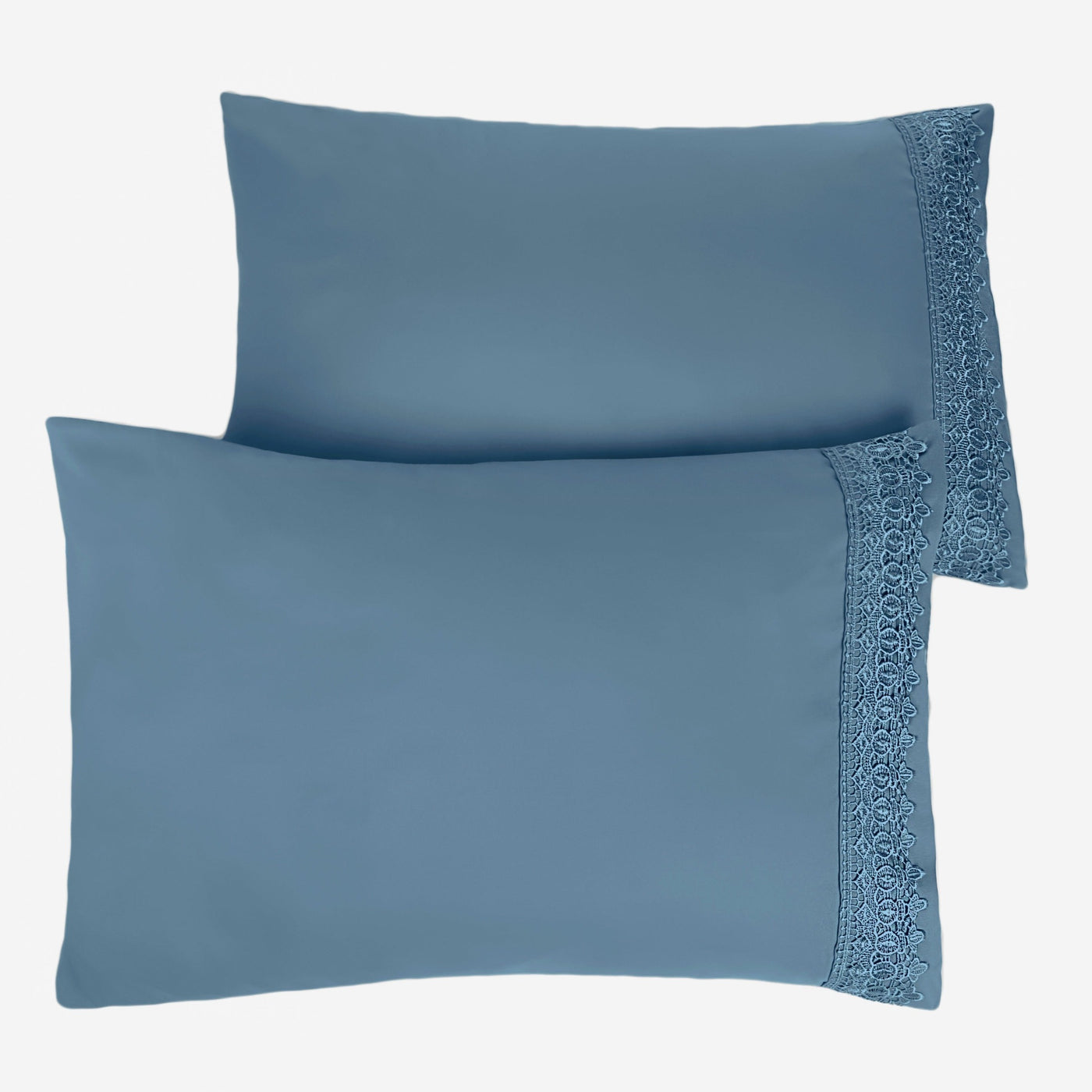 Two Vilano Lace Hem Pillow Cases in Coronet Blue Stack Together#color_vilano-coronet-blue