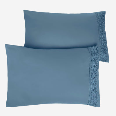 Two Vilano Lace Hem Pillow Cases in Coronet Blue Stack Together#color_vilano-coronet-blue