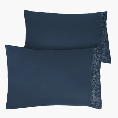 Two Vilano Lace Hem Pillow Cases in Dark Blue Stack Together#color_vilano-dark-blue